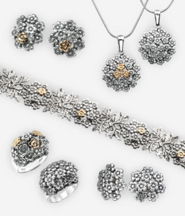 The Betty jewellery collection crafted in oxidized 925 sterling silver featuring flower pattern and 14k gold accents