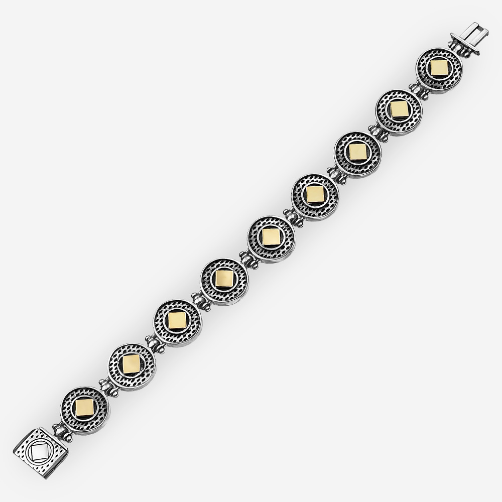 Pulsera de plata de dos tonos con enlaces de diseño geométrico y acentos de oro.